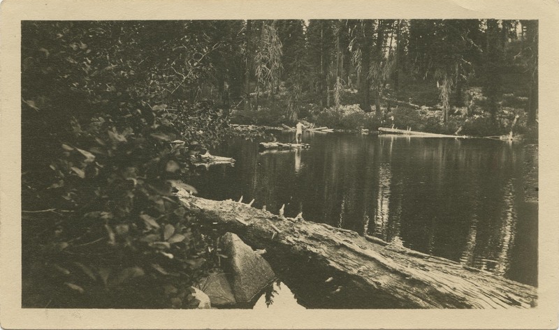 nude man on homemade raft - unknown lake